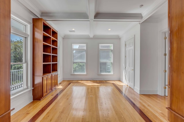 interior space with coffered ceiling, beam ceiling, light hardwood / wood-style floors, and crown molding