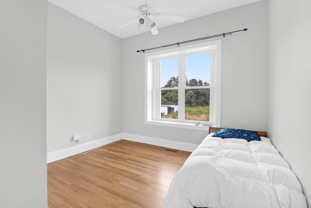 bedroom featuring wood-type flooring and ceiling fan