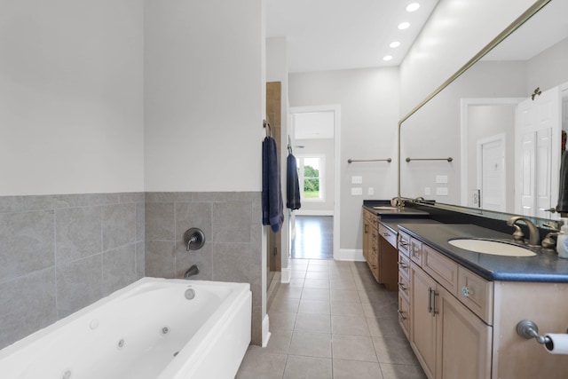 bathroom with tile patterned flooring, vanity, and separate shower and tub