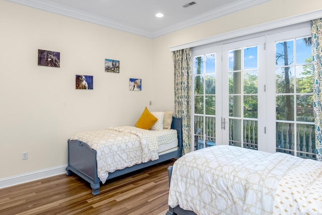 bedroom featuring access to outside, crown molding, baseboards, and wood finished floors