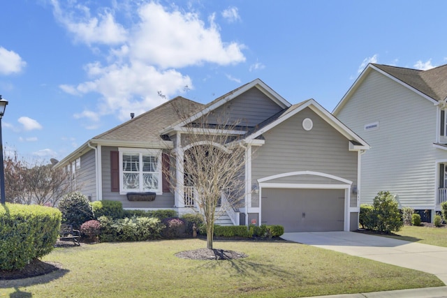345 Turnstone St, Mount Pleasant, SC 29464 - view of front facade featuring driveway, an attached garage, a shingled roof, and a front yard