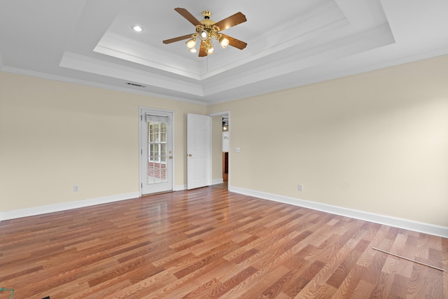331 Kinard St, Orangeburg, SC 29118 - unfurnished room with a tray ceiling, light wood-style flooring, ceiling fan, crown molding, and recessed lighting