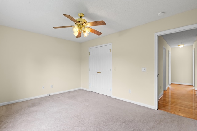 331 Kinard St, Orangeburg, SC 29118 - unfurnished bedroom featuring carpet flooring, a closet, and a ceiling fan