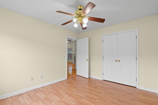 331 Kinard St, Orangeburg, SC 29118 - unfurnished bedroom with light wood finished floors, a closet, and a ceiling fan