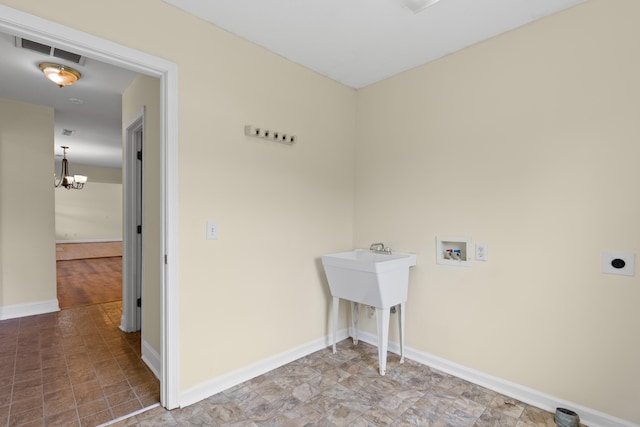 331 Kinard St, Orangeburg, SC 29118 - laundry area featuring hookup for a washing machine, hookup for an electric dryer, and a chandelier