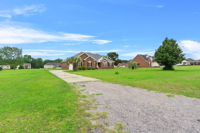 331 Kinard St, Orangeburg, SC 29118 - view of front of home featuring gravel driveway, a front lawn, and a garage