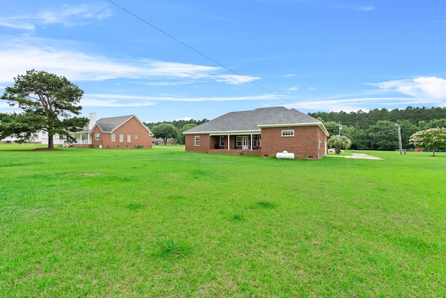 331 Kinard St, Orangeburg, SC 29118 - back of property featuring a lawn and brick siding