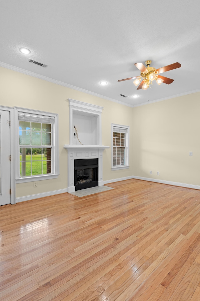 331 Kinard St, Orangeburg, SC 29118 - unfurnished living room featuring a fireplace with flush hearth, ornamental molding, light wood-style floors, a ceiling fan, and recessed lighting