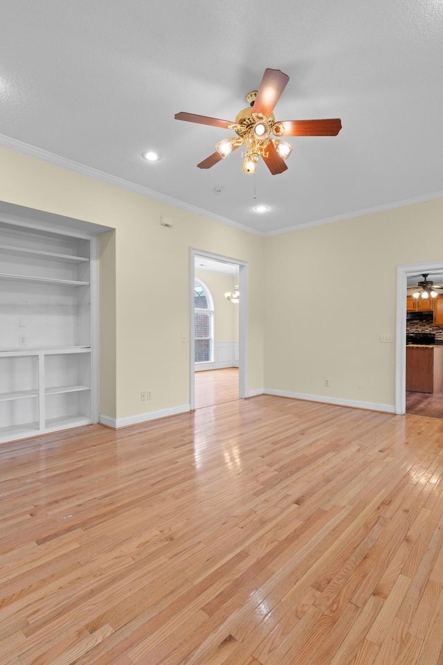 331 Kinard St, Orangeburg, SC 29118 - unfurnished living room featuring ornamental molding, ceiling fan, light wood-style flooring, recessed lighting, and a chandelier