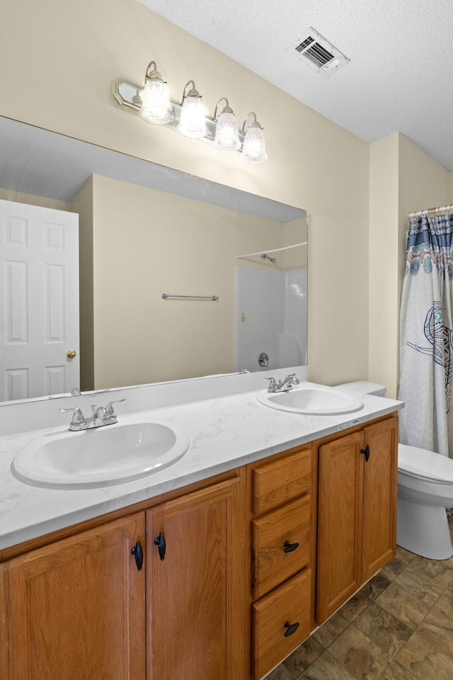 331 Kinard St, Orangeburg, SC 29118 - full bath featuring double vanity, a shower with shower curtain, and a textured ceiling