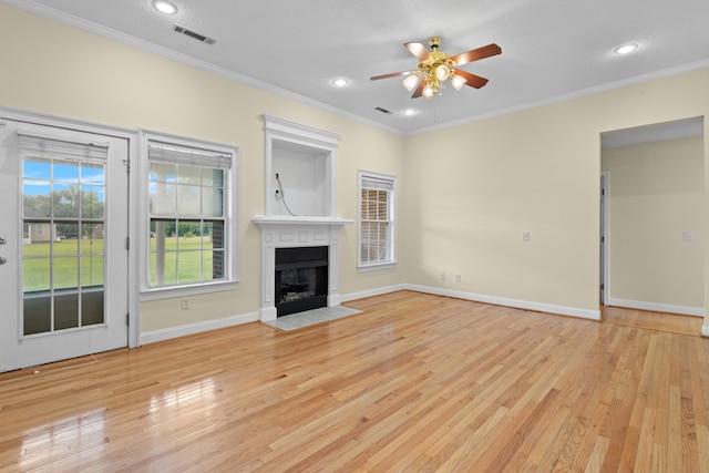 331 Kinard St, Orangeburg, SC 29118 - unfurnished living room featuring ceiling fan, light wood finished floors, a fireplace with flush hearth, crown molding, and recessed lighting