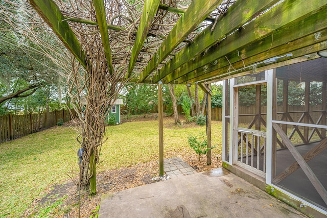 view of yard with a patio and a storage unit