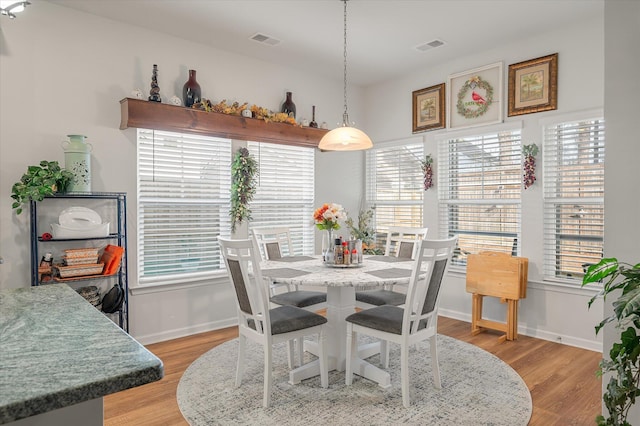 dining room featuring light hardwood / wood-style floors