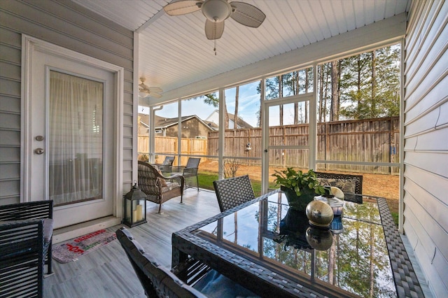 sunroom / solarium with ceiling fan