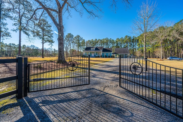 view of gate featuring a lawn