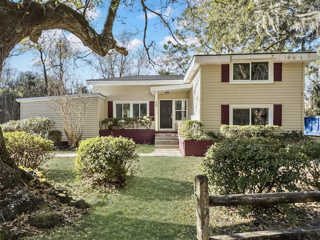 view of front of home with a front lawn