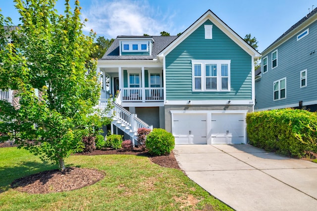 view of front of house featuring stairs, a garage, a porch, concrete driveway, and a front lawn
