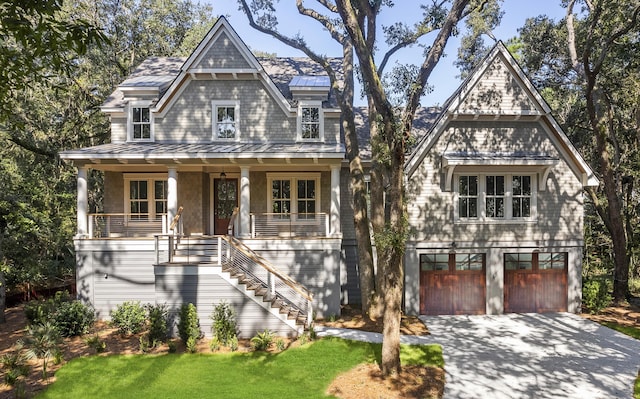 view of front of house with a porch and a garage