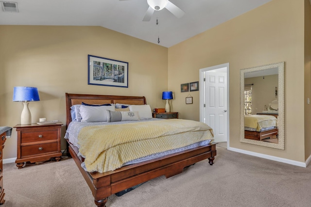 bedroom with ceiling fan, light colored carpet, and lofted ceiling