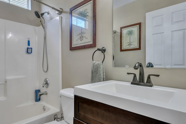 full bathroom featuring toilet, vanity, and bathing tub / shower combination