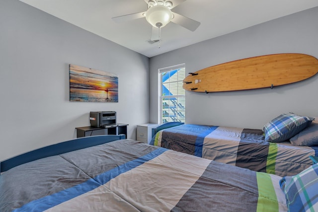 bedroom featuring ceiling fan