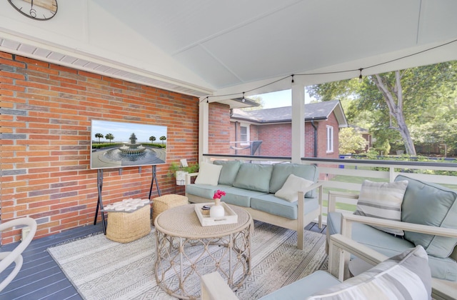 wooden deck featuring an outdoor living space