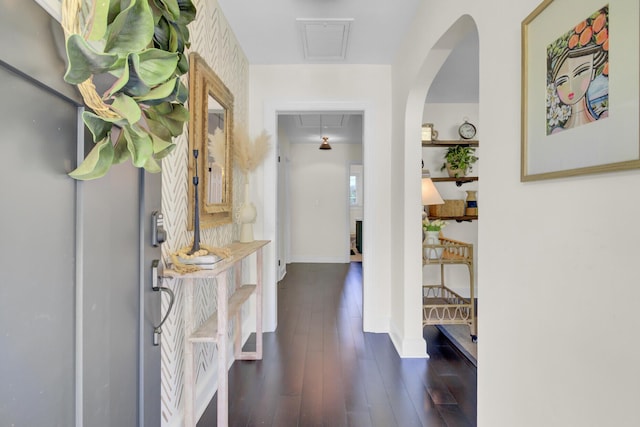 foyer featuring baseboards, visible vents, and dark wood-style floors