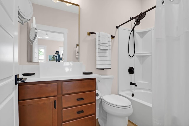 full bathroom featuring ceiling fan, vanity, shower / tub combo, and toilet