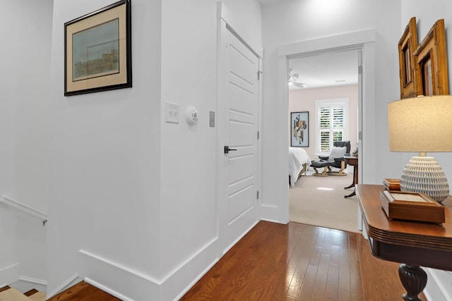 corridor with hardwood / wood-style floors