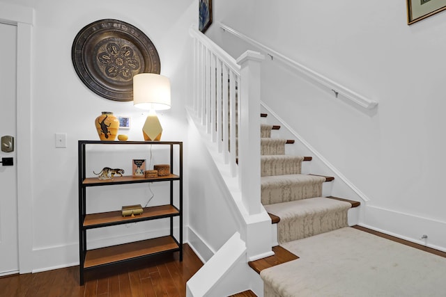 stairway featuring hardwood / wood-style flooring