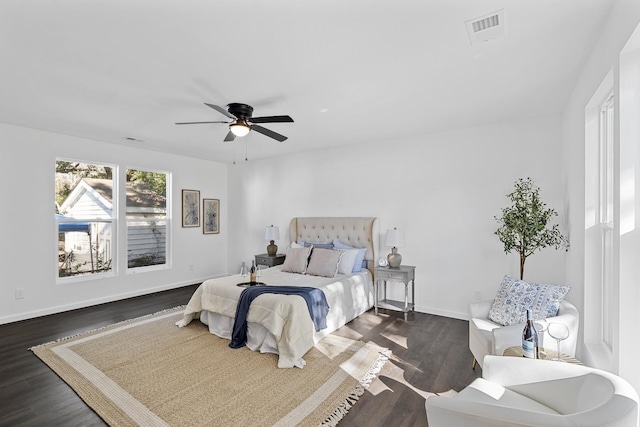 bedroom with ceiling fan and dark hardwood / wood-style floors