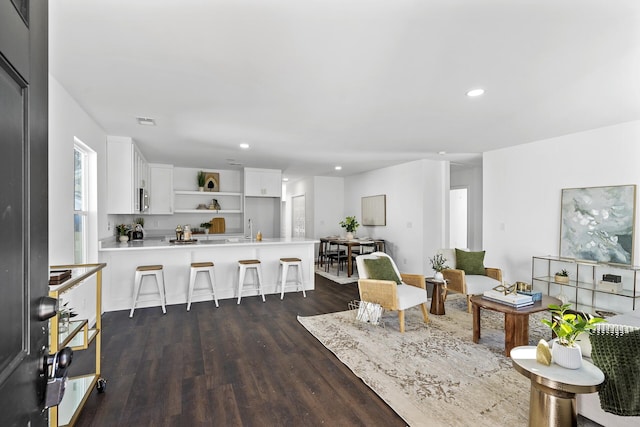 living room featuring dark hardwood / wood-style flooring