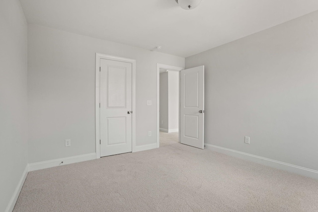 unfurnished bedroom with light carpet