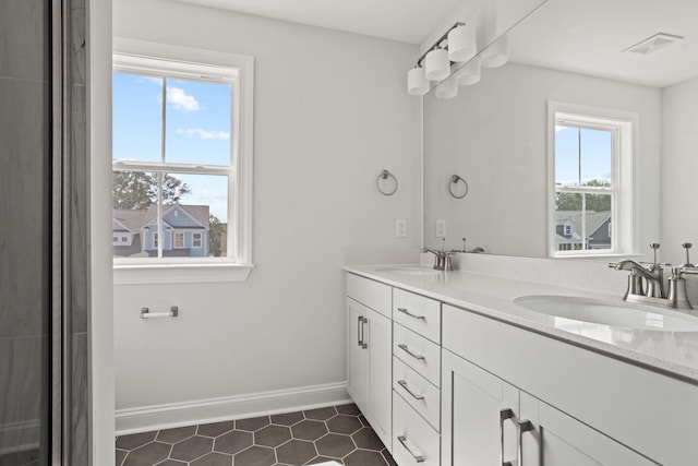 bathroom with vanity and tile patterned flooring