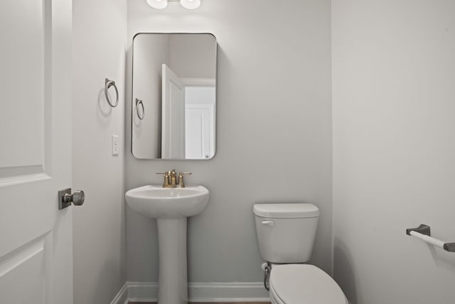 bathroom featuring toilet