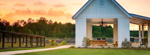 view of property's community with a lawn and a patio