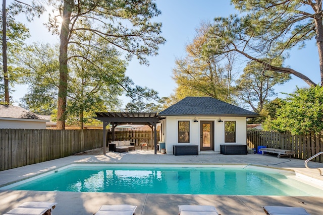 view of pool featuring a patio area, a pergola, a fenced backyard, an outdoor structure, and a storage structure