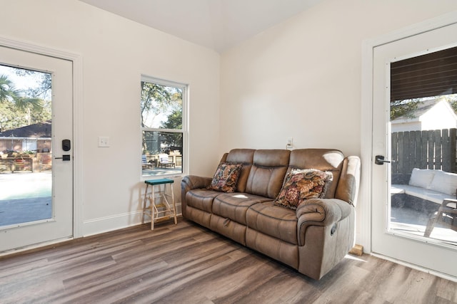 living room featuring baseboards and wood finished floors