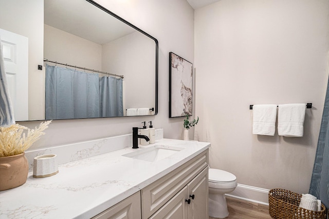 82 Ponsbury Rd, Mount Pleasant, SC 29464 - full bath with vanity, wood finished floors, toilet, and baseboards