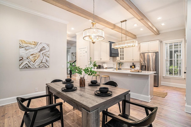 82 Ponsbury Rd, Mount Pleasant, SC 29464 - dining room featuring ornamental molding, baseboards, beam ceiling, light wood-style flooring, and a chandelier