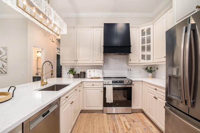 82 Ponsbury Rd, Mount Pleasant, SC 29464 - kitchen with stainless steel appliances, custom range hood, a sink, crown molding, and white cabinetry
