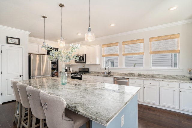 121 Cherry Grv, Summerville, SC 29483 - kitchen featuring appliances with stainless steel finishes, a sink, ornamental molding, white cabinetry, and dark wood-style flooring