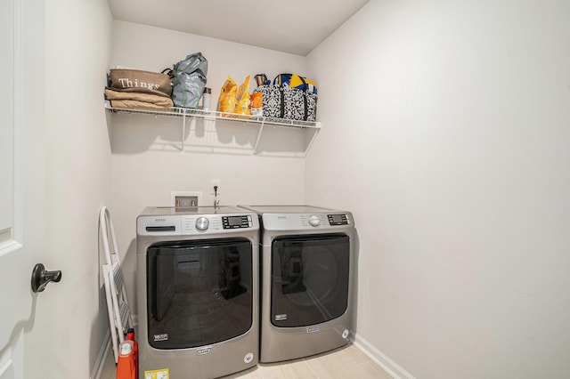 121 Cherry Grv, Summerville, SC 29483 - laundry room featuring washing machine and clothes dryer and baseboards