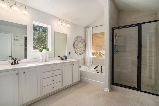 121 Cherry Grv, Summerville, SC 29483 - bathroom featuring double vanity, a garden tub, a shower stall, and lofted ceiling