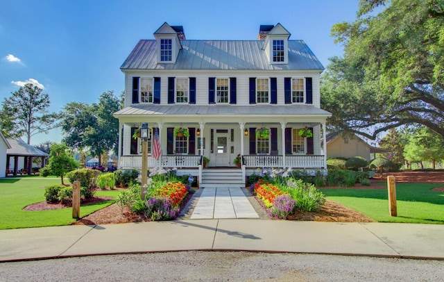 121 Cherry Grv, Summerville, SC 29483 - view of front of home featuring a front lawn, covered porch, and metal roof