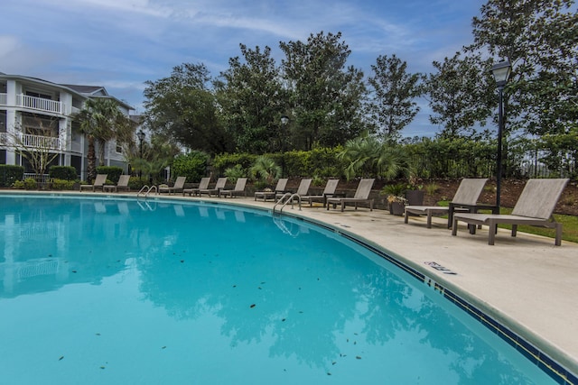 community pool featuring a patio area