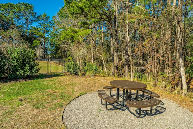 view of yard featuring a patio, a gate, and fence