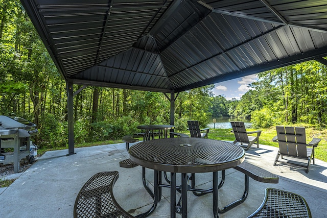 view of patio with a gazebo and outdoor dining space