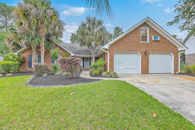 view of front of property featuring brick siding, a garage, a front yard, and driveway