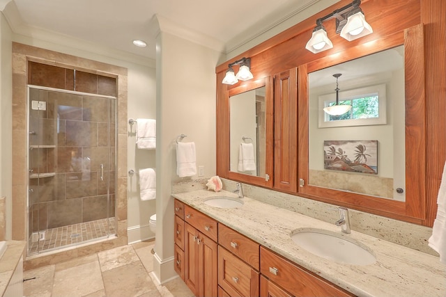 bathroom with a shower with shower door, toilet, vanity, and ornamental molding